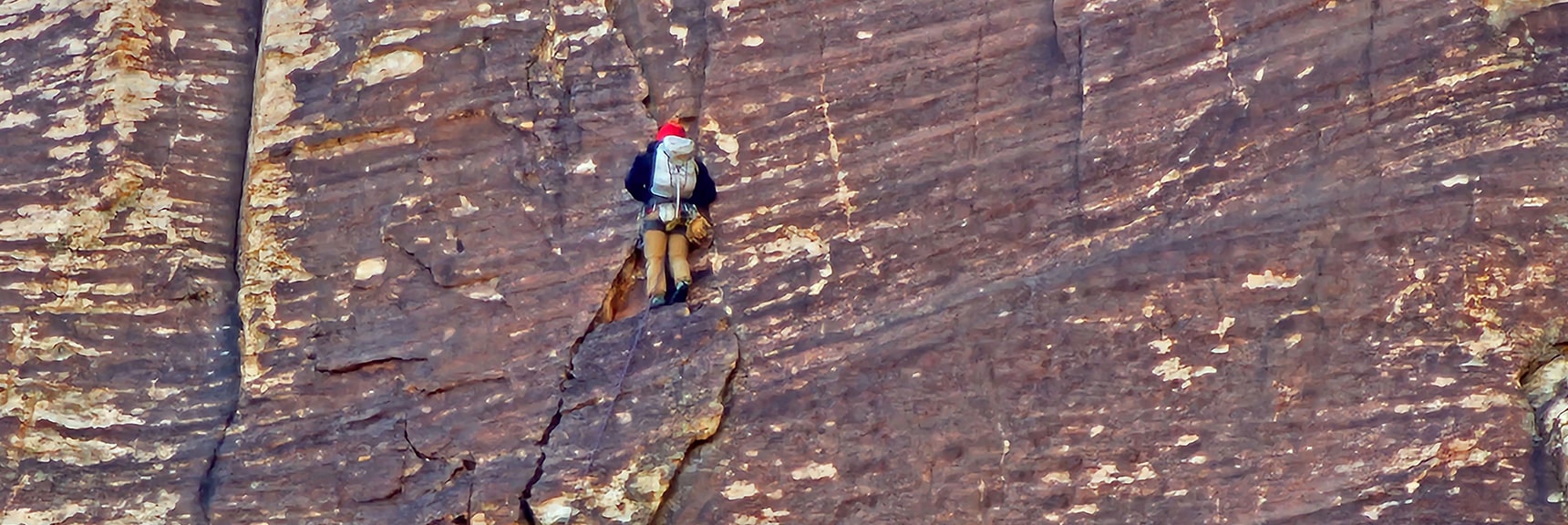 Resting on a Very Narrow, High Ledge | Rainbow Mountain Eastern Cliffs Rock Climbers | Rainbow Mountain Wilderness, Nevada