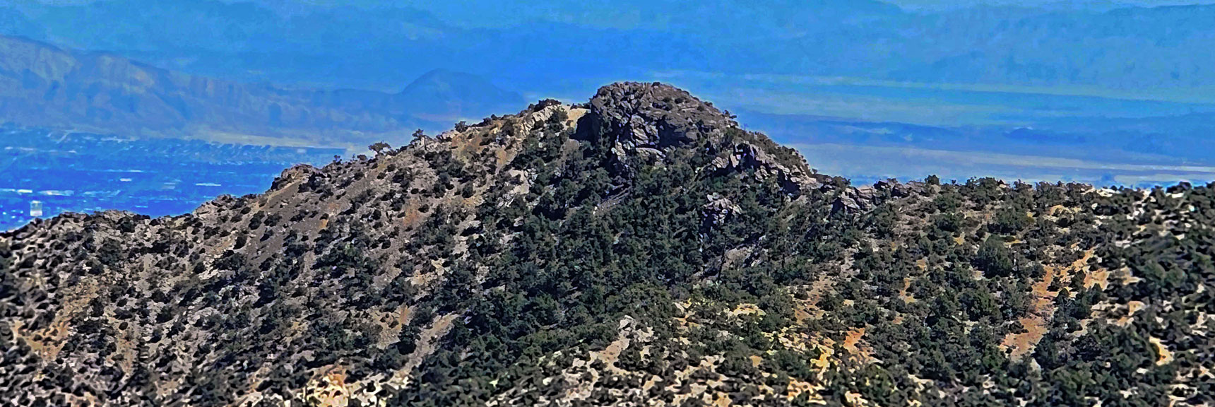 Zoom in on North Peak. Las Vegas Valley Background. | Red Rock Summit | Lovell Canyon & Rainbow Mountain Wilderness, Nevada