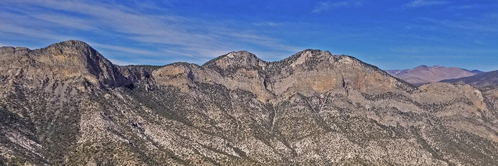 Pinnacle is Left of Two High Points on Wilson Ridgeline. View from North Peak. | Mini Matterhorn Pinnacle | Wilson Ridge | Lovell Canyon, Nevada