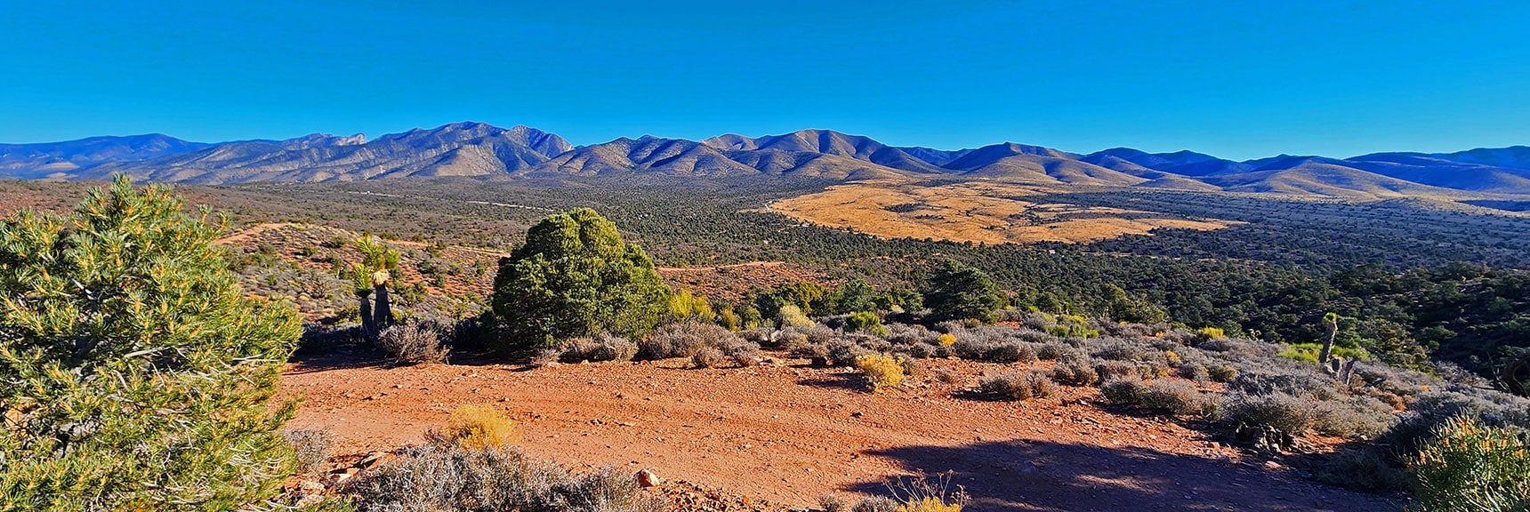Rainbow Mountains and Lower Lovell Canyon Stretching South Toward Potosi Mountain. | Landmark Bluff Circuit | Lovell Canyon, Nevada