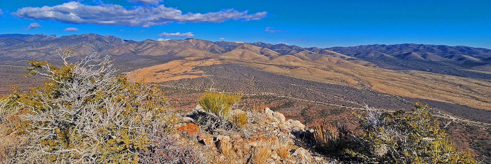 View East to Rainbow Mts. Ridgeline. Rainbow Springs Rd. (right); Salt Grass Rd. (left) | Landmark Bluff Summit | Lovell Canyon, Nevada