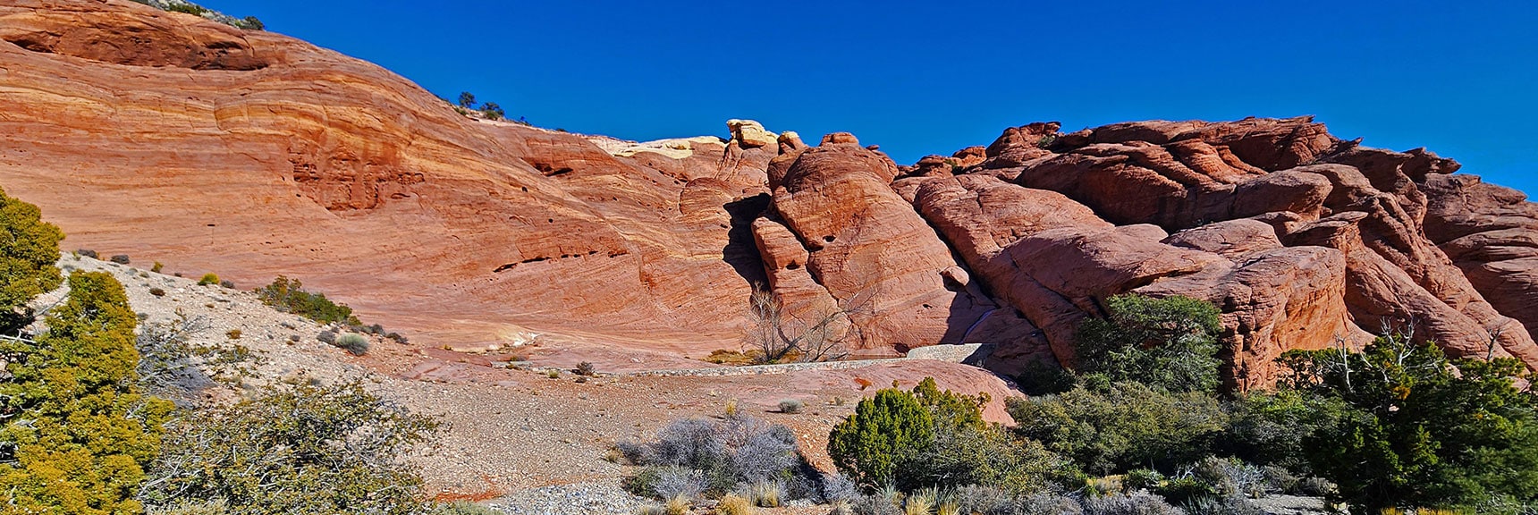 Natural Ephemeral Pool with Added Support Wall Nestled in Hills. | Brownstone Trail | Calico Basin | Brownstone Basin | La Madre Mountains Wilderness, Nevada