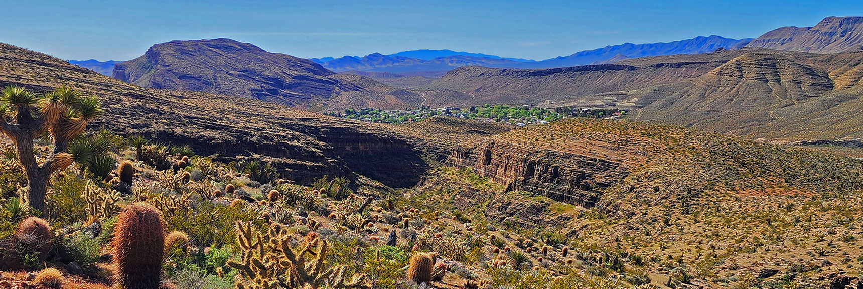 View Down Canyon from Summit Reveals Canyon and Town of Blue Diamond Below. | Blue Diamond Hill Southern Triangle | Red Rock Canyon National Conservation Area, Nevada
