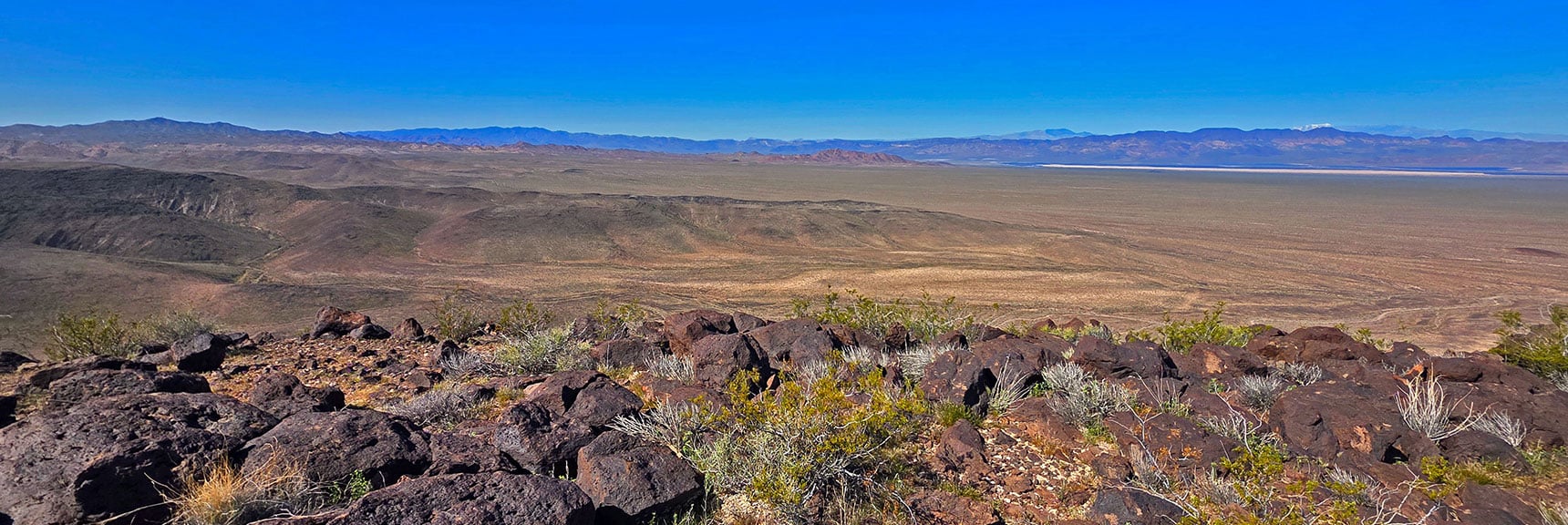 View West Back to Nelson Hills Start Point. Snow on Mt. Charleston Visible (horizon). | Pilot Cone | Pilot Mesa | Peeper Benchmark | Eldorado Wilderness, Nevada