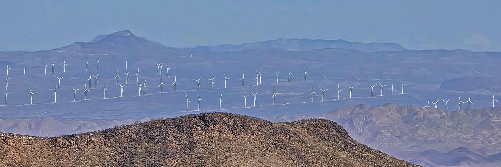Arizona White Hills Wind Farm's Spinning Turbines Seen from SE Summit | Pilot Cone | Pilot Mesa | Peeper Benchmark | Eldorado Wilderness, Nevada