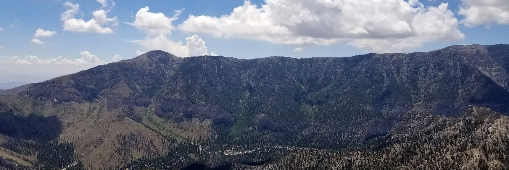 Griffith Peak and Kyle Canyon North Rim from Fletcher Peak Summit. Charleston Village Below. | Grand Circuit Loop Cougar Ridge Trail, Mummy Mountain Knees | Mummy Mountain Toe | Mummy Springs | Raintree | Fletcher Peak | Mt Charleston Wilderness | Spring Mountains, Nevada