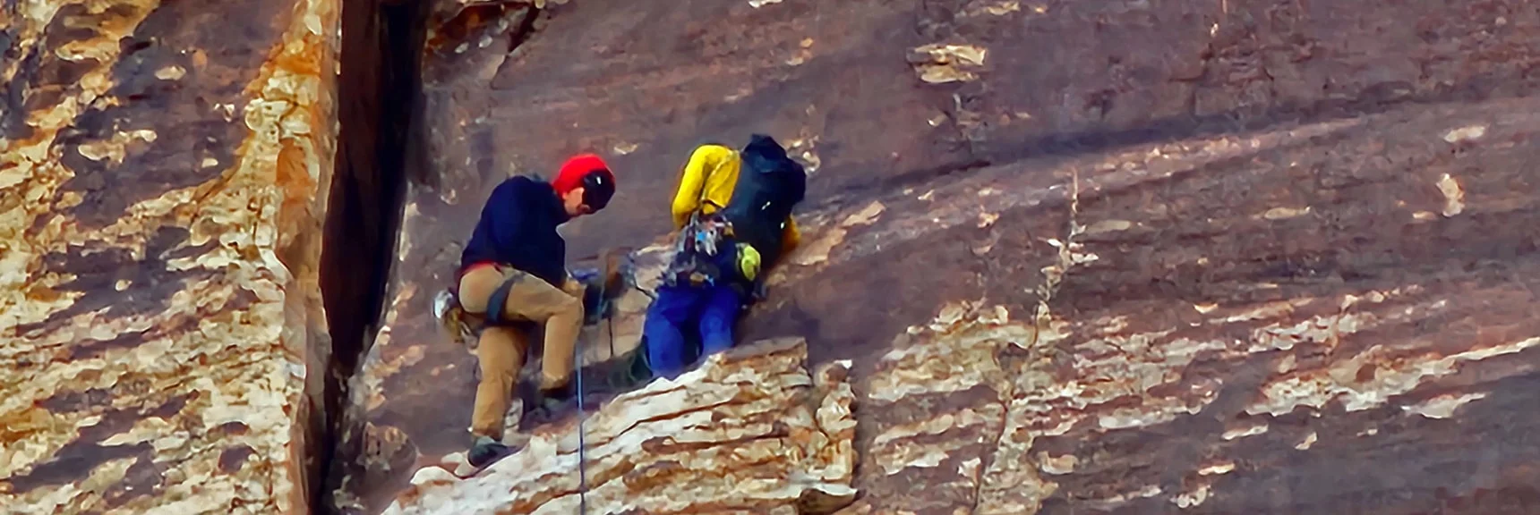 Resting and Regrouping on a Narrow Ledge | Rainbow Mountain Eastern Cliffs Rock Climbers | Rainbow Mountain Wilderness, Nevada