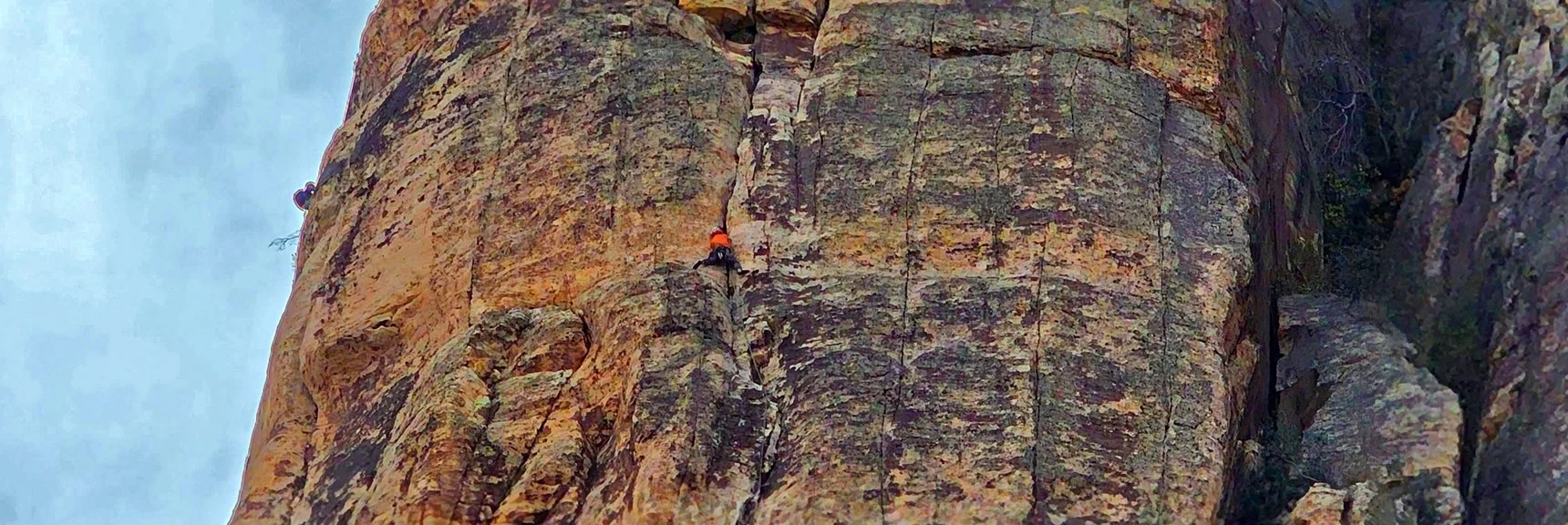 Rock Climber Ascending a Crack | Rainbow Mountain Eastern Cliffs Rock Climbers | Rainbow Mountain Wilderness, Nevada