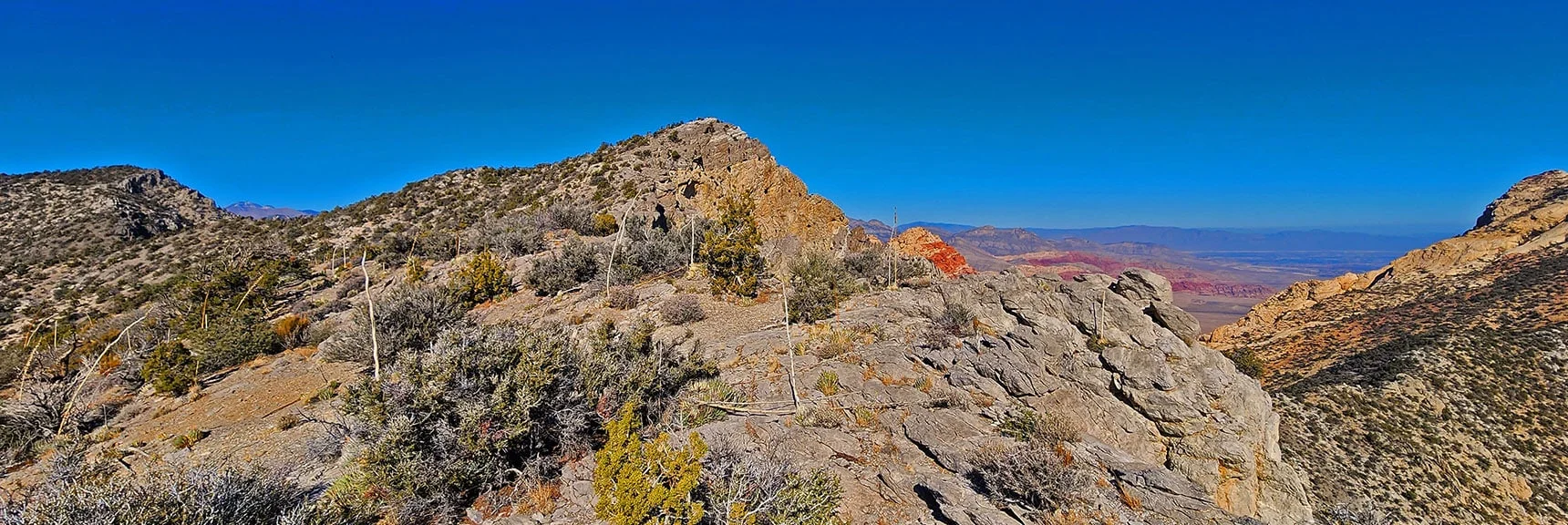 First Creek Canyon Overlook Cliff Just North, Tip of Rainbow Mt Below. | Rainbow Mountains Mid Upper Crest Ridgeline from Lovell Canyon, Nevada