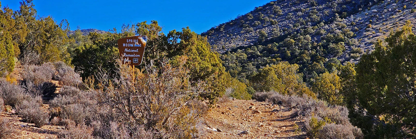 Past Road Ending, Now into Approach Canyon, Entering Spring Mts. Nat Rec Area | Rainbow Mountains Mid Upper Crest Ridgeline from Lovell Canyon, Nevada