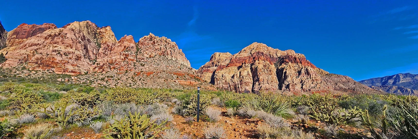 Arnight Trail is Well Signed. Juniper Peak (left), Bridge Mt. (right) | Arnight Trail | Red Rock Canyon, Nevada | David Smith | LasVegasAreaTrails.com