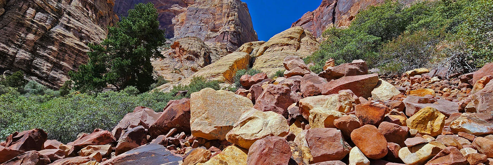Now on Boulders. Note Cairn to Right. | Juniper Canyon | Red Rock Canyon National Conservation Area, Nevada | David Smith | LasVegasAreaTrails.com