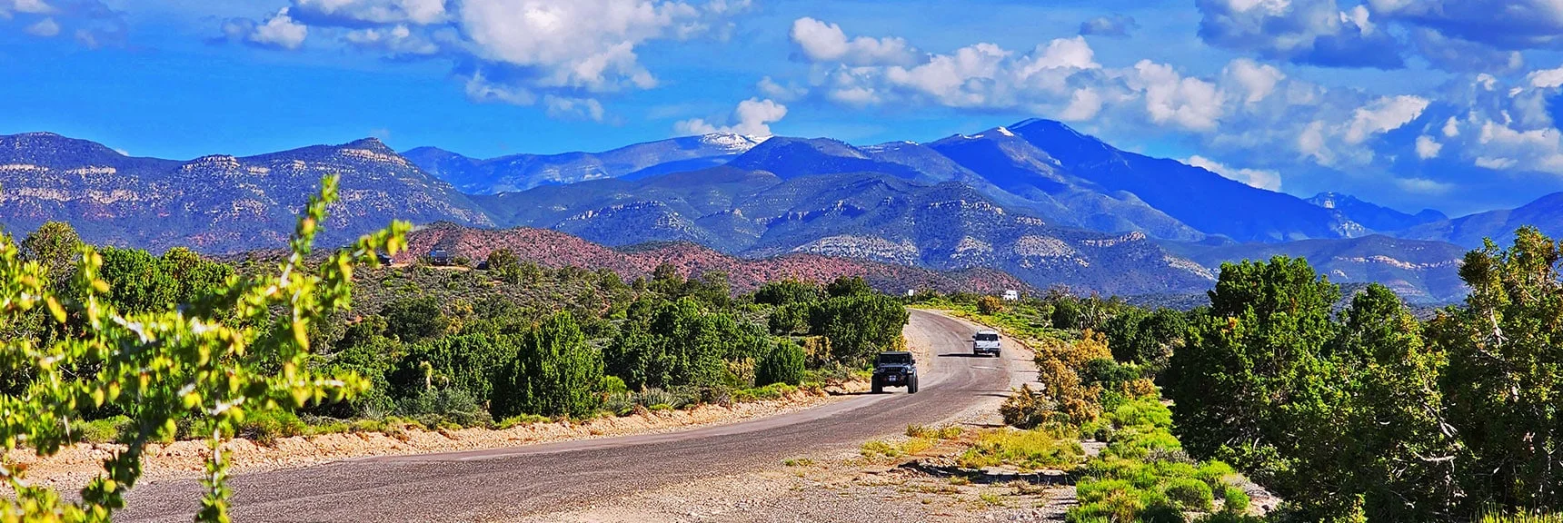 Approaching High Point on Lovell Canyon Road. Many Campers. | Juniper Peak to Mt. Wilson | Rainbow Mountains Upper Crest Ridgeline, Nevada