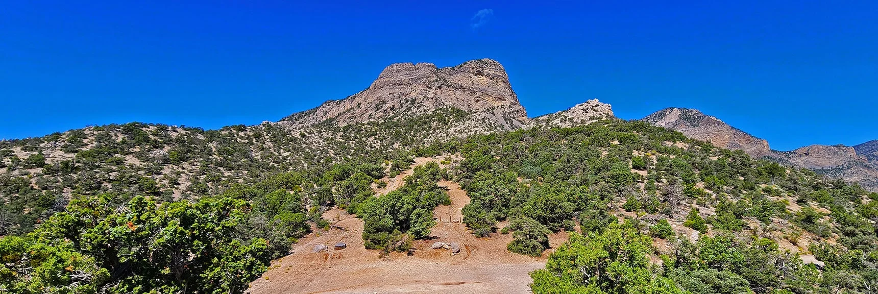 Arrival at Bridge Mt. Trailhead. Note High Red Rock Summit and Lower White Bluff to the Right. | Rocky Gap Rd to Bridge Mt Trailhead | Lovell Canyon, Nevada