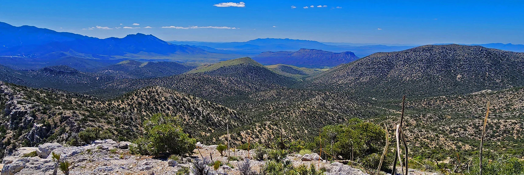 Moving North on Ridgeline. View Back Through Gap to Landmark Bluff at Lovell Canyon Rd. | Mt Wilson to Juniper Peak | Rainbow Mountains Upper Crest Ridgeline | Rainbow Mountain Wilderness, Nevada