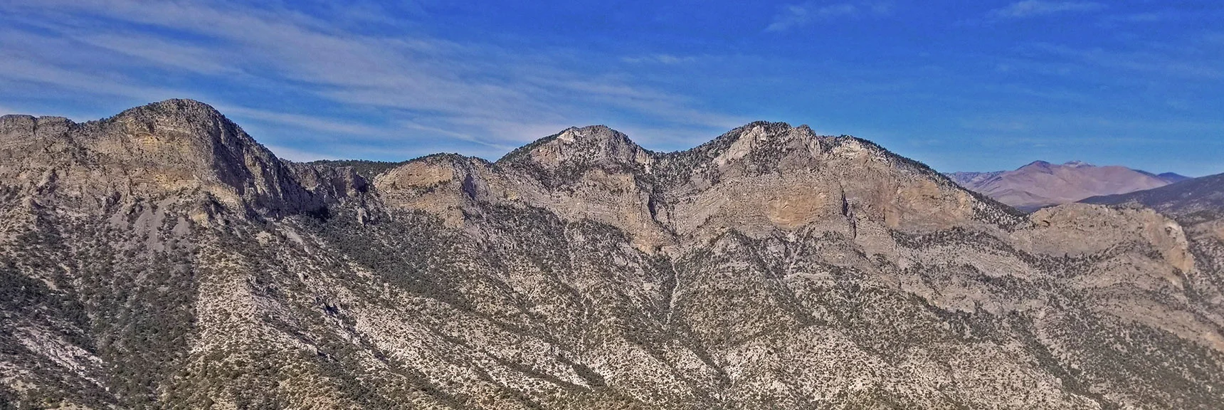Pinnacle is Left of Two High Points on Wilson Ridgeline. View from North Peak. | Mini Matterhorn Pinnacle | Wilson Ridge | Lovell Canyon, Nevada