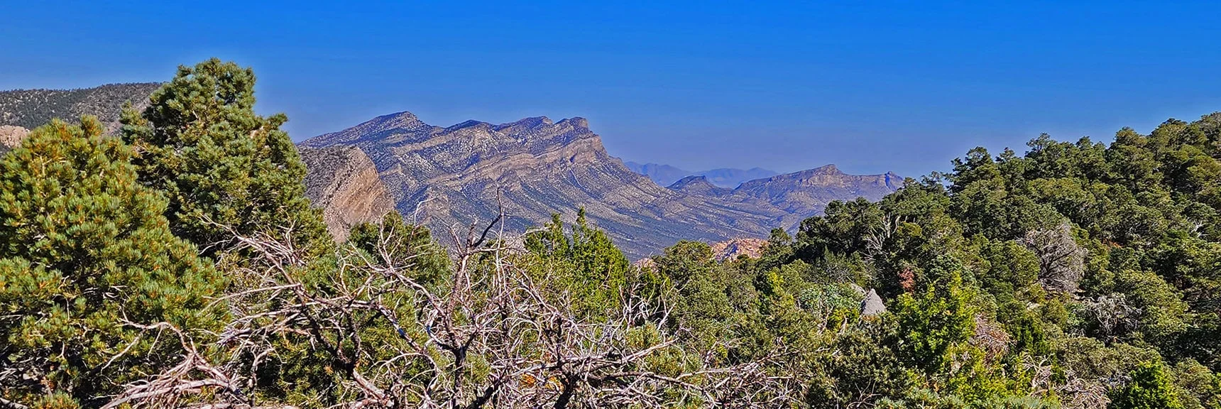 Crescent-Shaped La Madre Mts. Ridgeline. Damsel Peak to Right. | Mini Matterhorn Pinnacle North Twin | Wilson Ridge | Lovell Canyon & Rainbow Mountains, Nevada