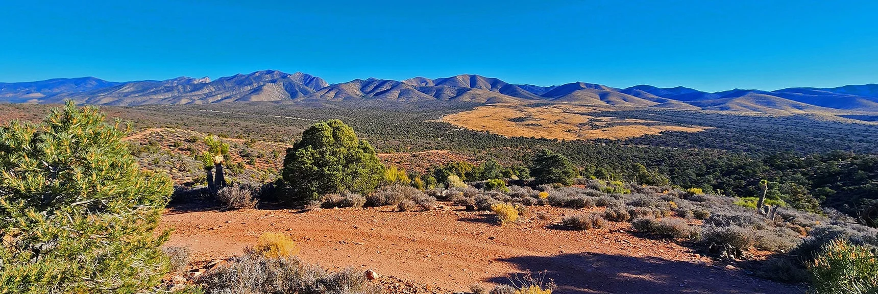 Rainbow Mountains and Lower Lovell Canyon Stretching South Toward Potosi Mountain. | Landmark Bluff Circuit | Lovell Canyon, Nevada