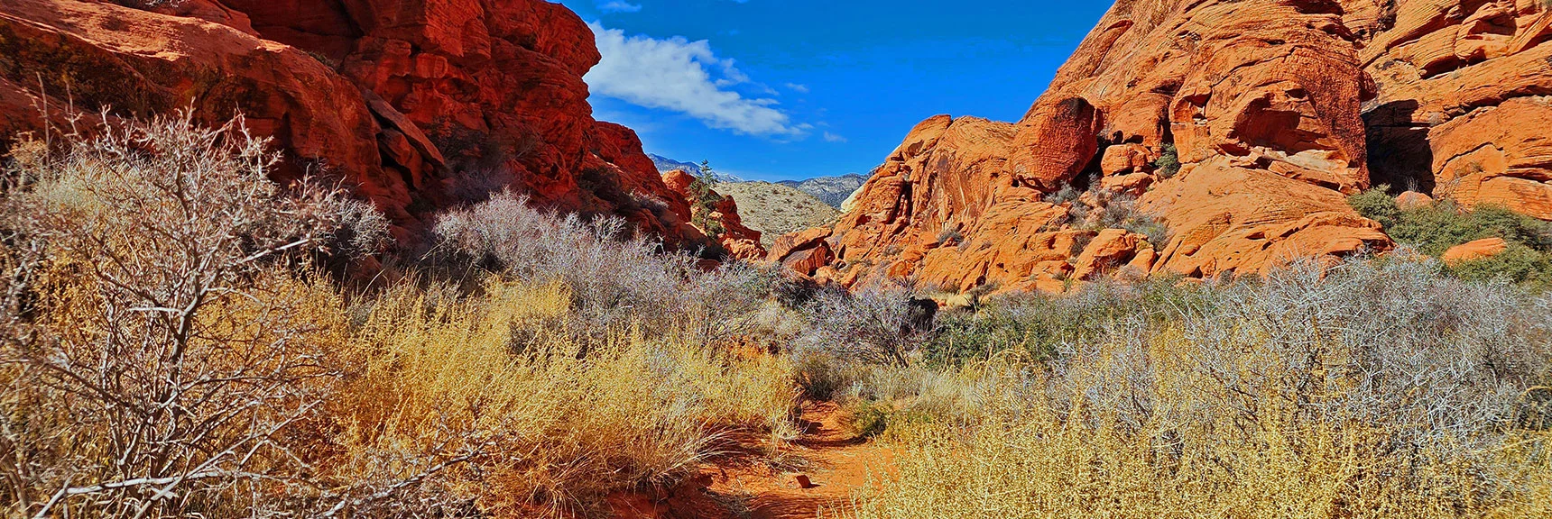 Nearing Base of Passage. Ridge Ahead Through Passage is Red Rock Scenic Drive Route | Lower Calico Hills Loop | Calico Basin & Red Rock Canyon, Nevada