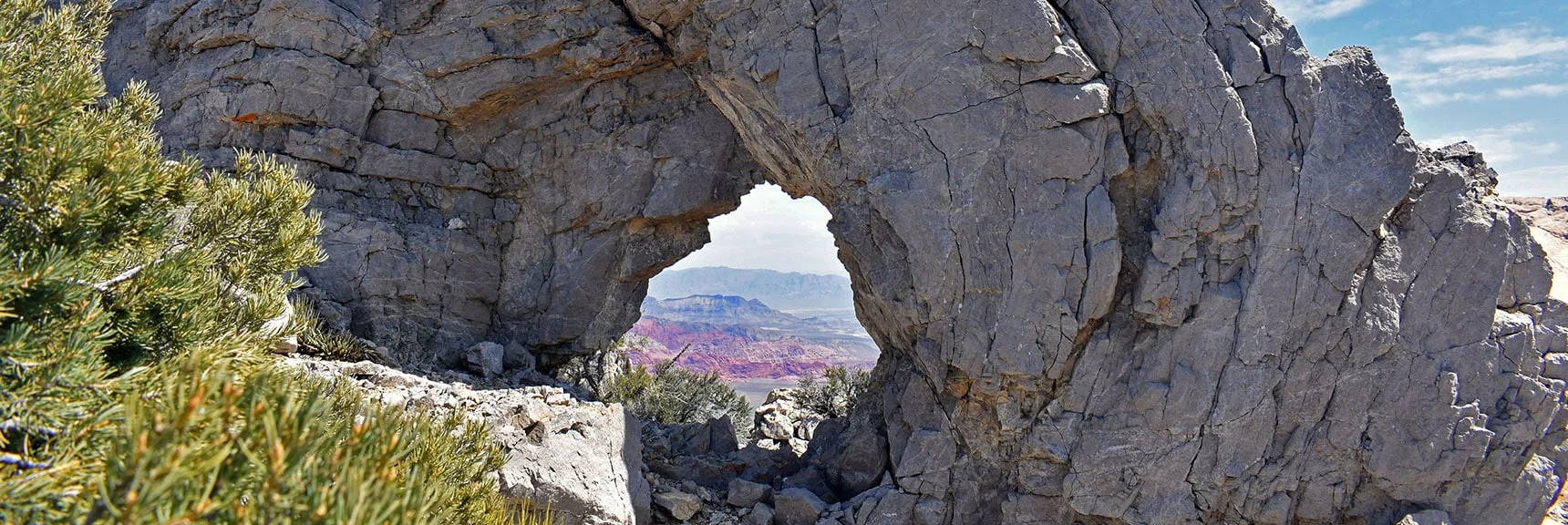 Head North (left): Natural Arch Near First Creek Overlook Cliff on the Upper Crest Ridgeline. | Mt Wilson Summit Saddle from Lovell Canyon | Rainbow Mountain Wilderness, Nevada
