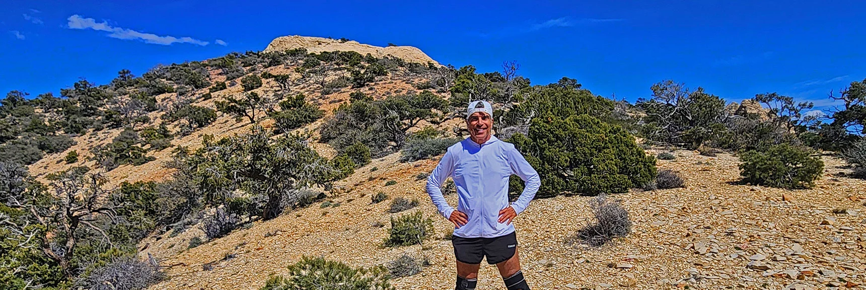 David Smith on the Mt. Wilson Summit Approach Saddle, Mt. Wilson Summit in Background. | Mt Wilson Summit Saddle from Lovell Canyon | Rainbow Mountain Wilderness, Nevada