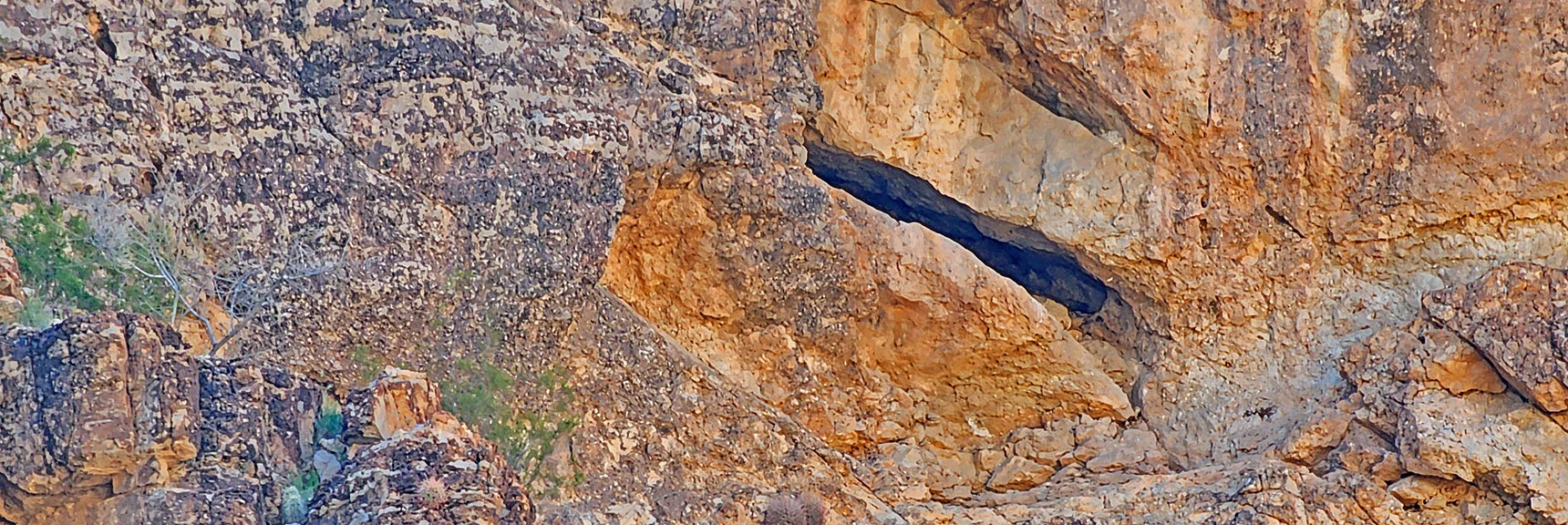 Another Cave. High on Cliff. Narrow Opening. | Blue Diamond Hill Southern Triangle | Red Rock Canyon National Conservation Area, Nevada
