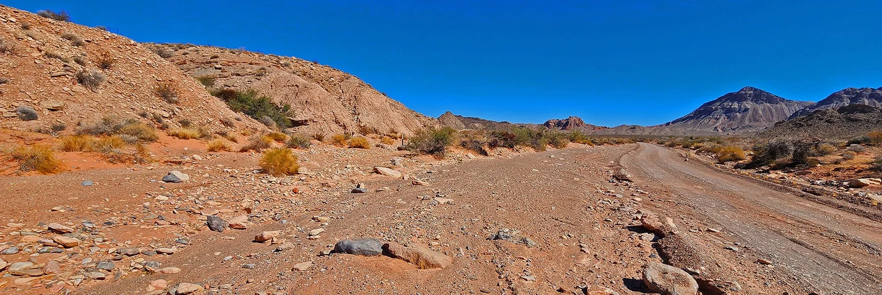 Trailhead at Base of Pointy Hill. Note Small Unmarked Posts to Left of Road. | Bowl of Fire SE Detailed | Lake Mead NRA, Nevada