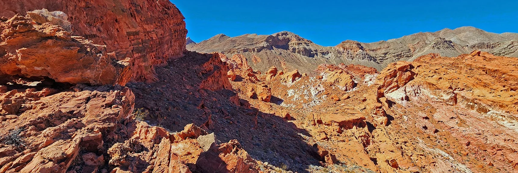 View Back Down Bowl Toward Distant Hills Surrounding Lake Mead | Bowl of Fire SE Detailed | Lake Mead NRA, Nevada