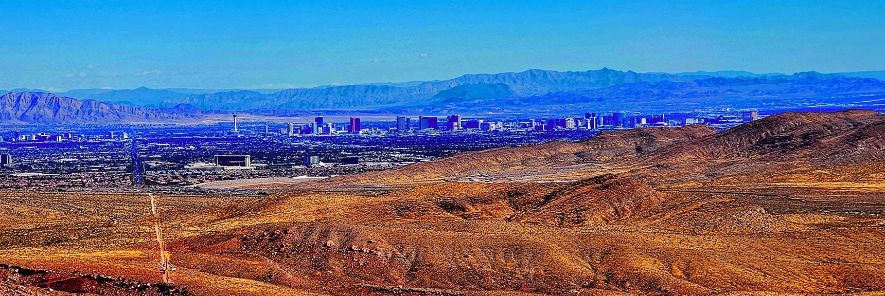 Vegas Strip Enlarged. Pointy Height on Background Ridge is Arizona Mt. Wilson | Calico Tanks from Guardian Angel Pass | Red Rock Canyon NCA, Nevada