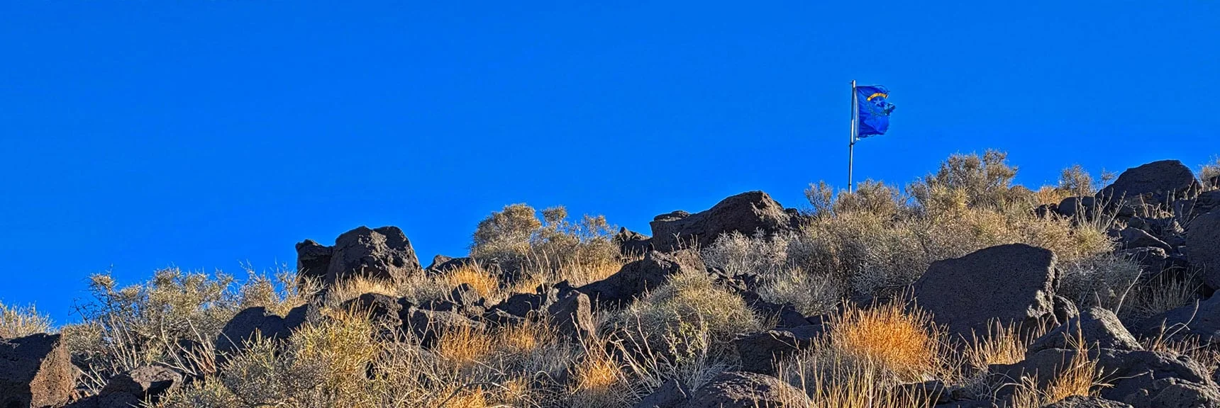Summit Flag Comes into View on Final Summit Approach. | Black Mountain North Loop | McCullough Hills | Sloan Canyon National Conservation Area, Nevada