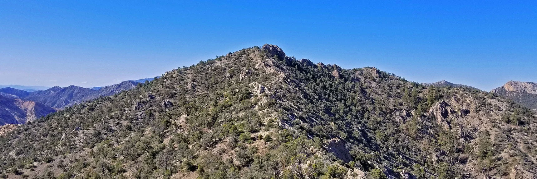 Blue Diamond Hill (R), Red Rock Canyon (Middle), Indecision Peak (L). | Monument Peak Summit | Rainbow Mountain Wilderness, Nevada