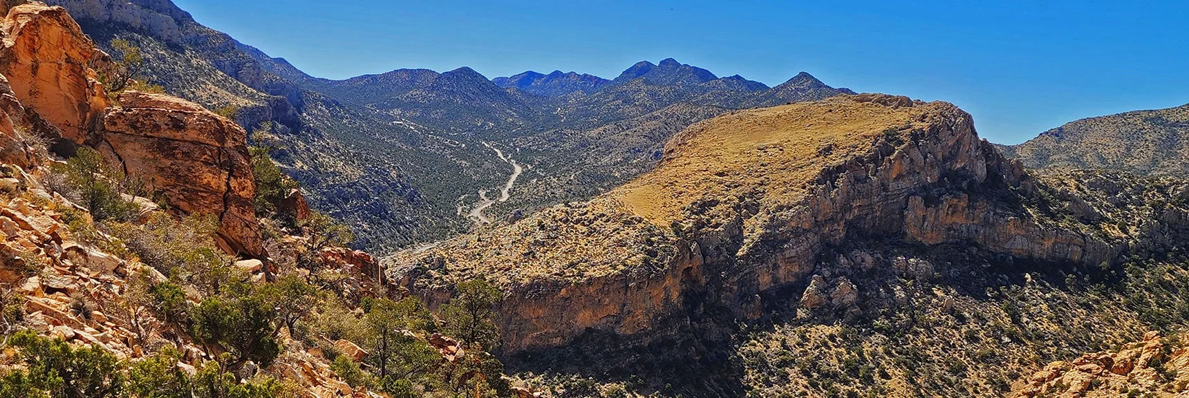 Blue Diamond Hill (R), Red Rock Canyon (Middle), Indecision Peak (L). | Monument Peak Summit | Rainbow Mountain Wilderness, Nevada
